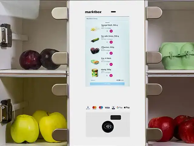 marktbox-Verkaufsautomat mit Touchscreen für die Produktauswahl und Terminal für kontaktlose Zahlungen